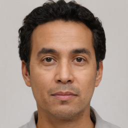 Neutral white adult male with short  black hair and brown eyes