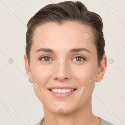 Joyful white young-adult female with short  brown hair and brown eyes