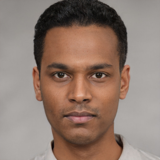 Neutral latino young-adult male with short  black hair and brown eyes