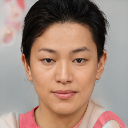 Joyful asian young-adult female with short  brown hair and brown eyes