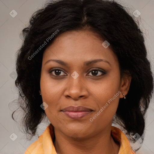 Joyful black adult female with medium  brown hair and brown eyes