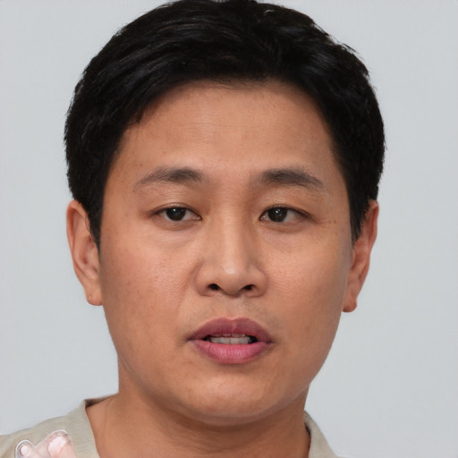 Neutral asian young-adult male with short  brown hair and brown eyes