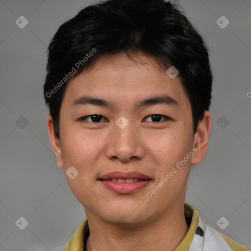 Joyful asian young-adult male with short  brown hair and brown eyes