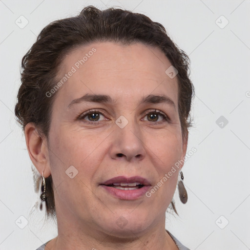 Joyful white adult female with short  brown hair and brown eyes