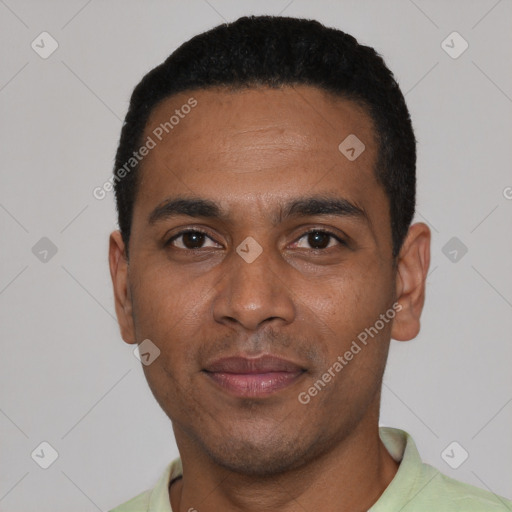 Joyful black young-adult male with short  black hair and brown eyes