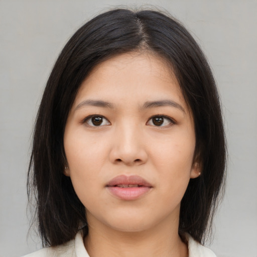 Neutral asian young-adult female with medium  brown hair and brown eyes