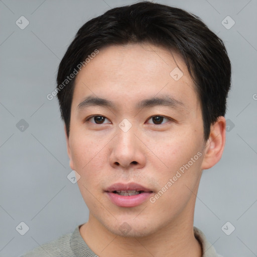 Neutral asian young-adult male with short  brown hair and brown eyes