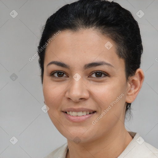 Joyful latino young-adult female with short  brown hair and brown eyes