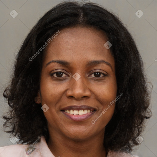 Joyful black young-adult female with medium  brown hair and brown eyes