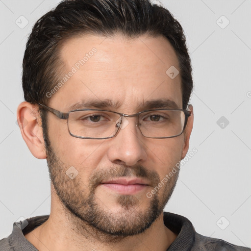 Joyful white adult male with short  brown hair and brown eyes