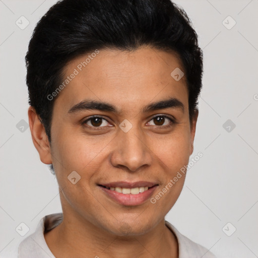 Joyful latino young-adult male with short  brown hair and brown eyes