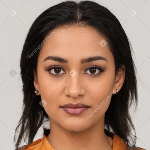 Joyful latino young-adult female with medium  brown hair and brown eyes