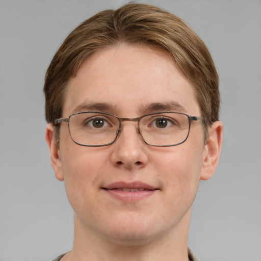 Joyful white adult male with short  brown hair and blue eyes