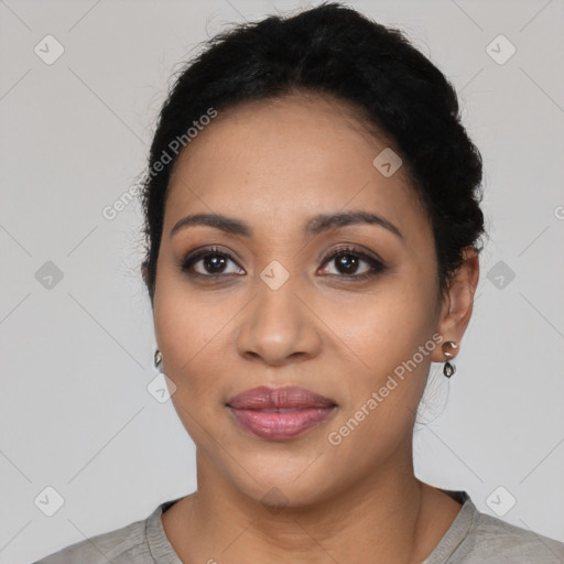 Joyful latino young-adult female with short  black hair and brown eyes