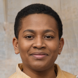 Joyful latino young-adult male with short  brown hair and brown eyes