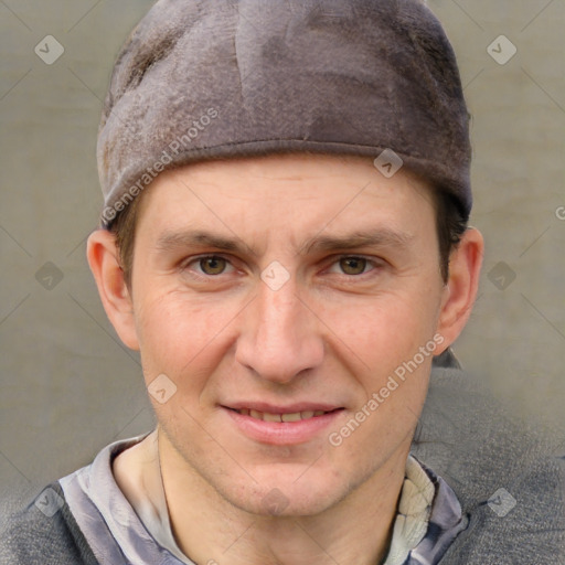 Joyful white adult male with short  brown hair and grey eyes