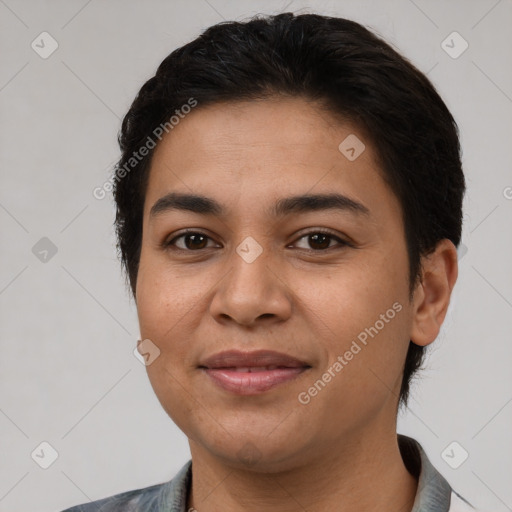 Joyful latino young-adult female with short  brown hair and brown eyes