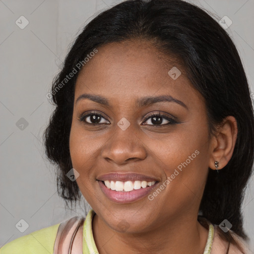 Joyful black young-adult female with medium  brown hair and brown eyes