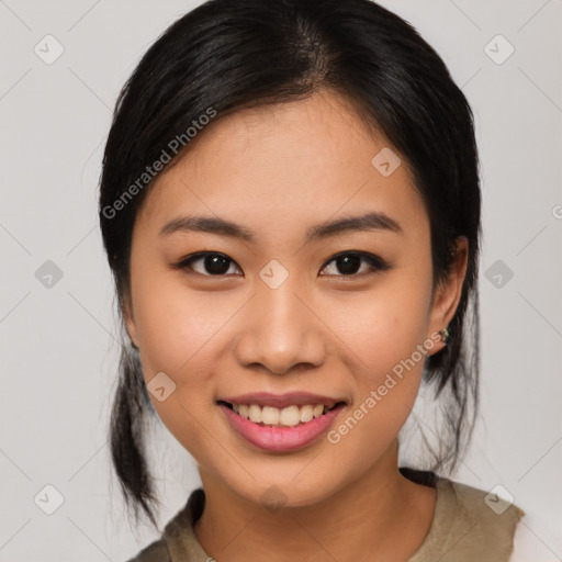 Joyful asian young-adult female with medium  black hair and brown eyes