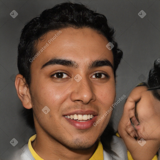 Joyful latino young-adult male with short  brown hair and brown eyes