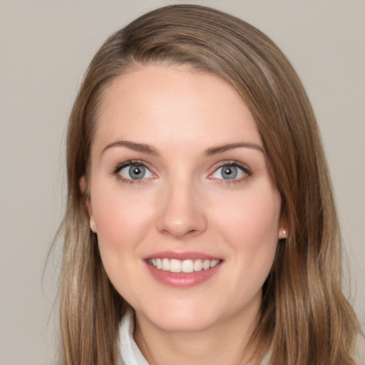 Joyful white young-adult female with long  brown hair and grey eyes