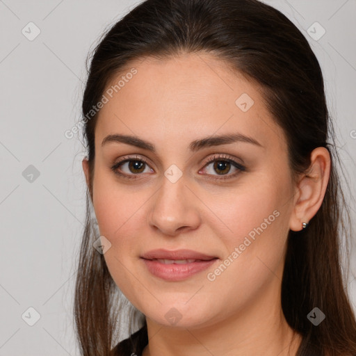 Joyful white young-adult female with long  brown hair and brown eyes