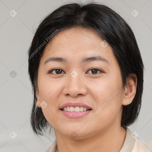 Joyful asian young-adult female with medium  brown hair and brown eyes