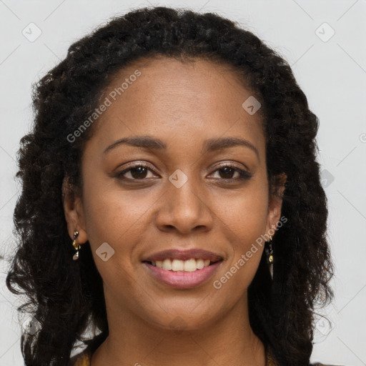 Joyful black young-adult female with long  brown hair and brown eyes