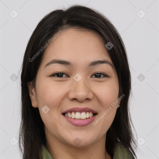 Joyful latino young-adult female with long  brown hair and brown eyes