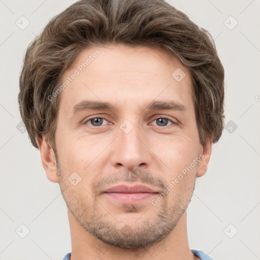 Joyful white adult male with short  brown hair and grey eyes