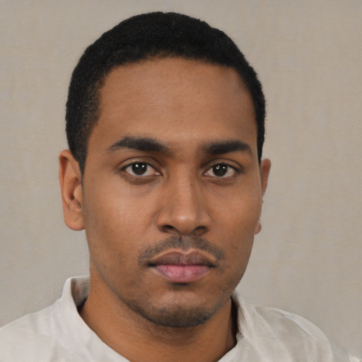 Neutral latino young-adult male with short  black hair and brown eyes
