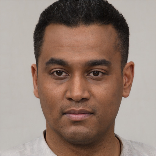Neutral latino young-adult male with short  black hair and brown eyes