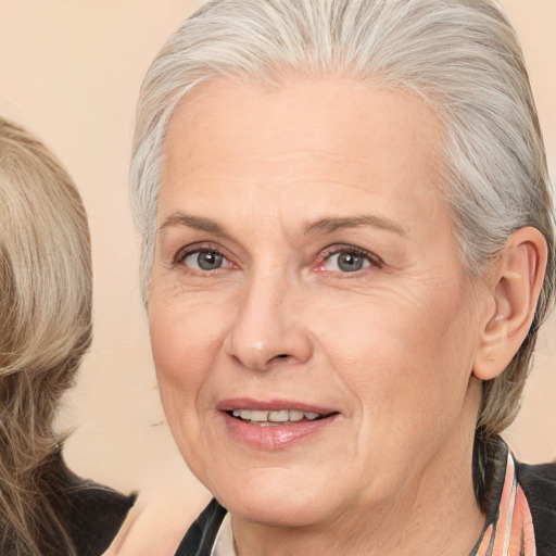 Joyful white middle-aged female with medium  blond hair and brown eyes