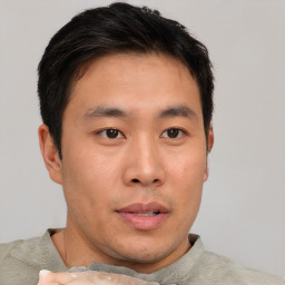 Neutral asian young-adult male with short  brown hair and brown eyes