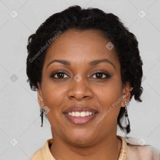 Joyful black adult female with short  brown hair and brown eyes