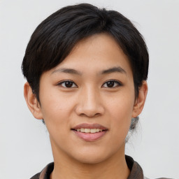 Joyful asian young-adult female with short  brown hair and brown eyes