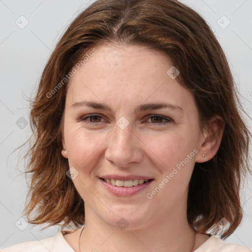 Joyful white young-adult female with medium  brown hair and green eyes