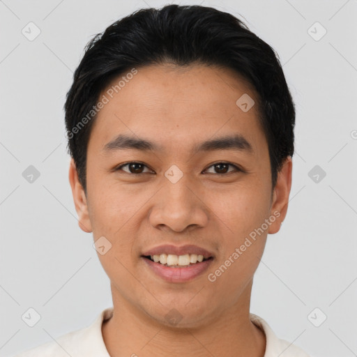 Joyful asian young-adult male with short  black hair and brown eyes