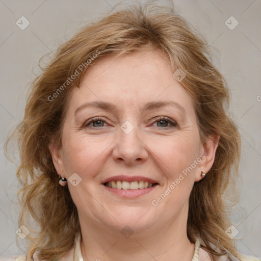 Joyful white young-adult female with medium  brown hair and blue eyes