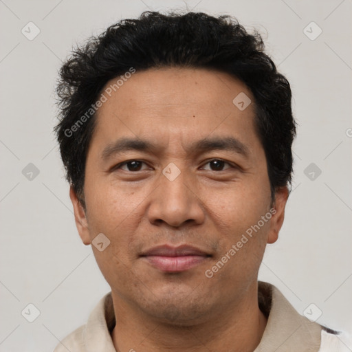 Joyful asian adult male with short  black hair and brown eyes