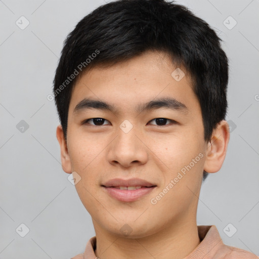 Joyful asian young-adult male with short  brown hair and brown eyes