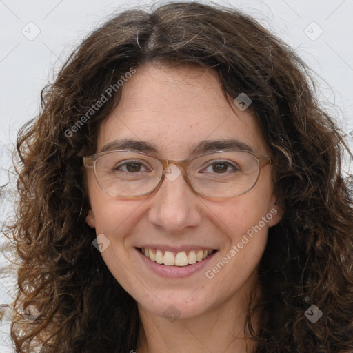 Joyful white adult female with long  brown hair and brown eyes