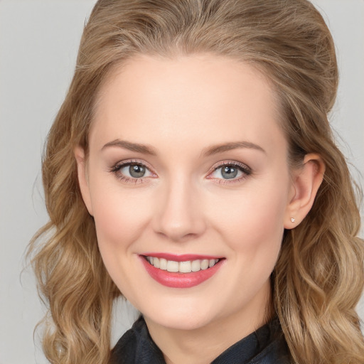 Joyful white young-adult female with long  brown hair and blue eyes