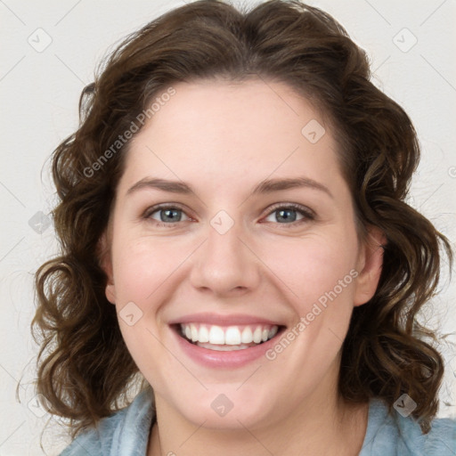 Joyful white young-adult female with medium  brown hair and blue eyes