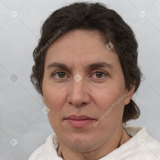 Joyful white adult female with short  brown hair and brown eyes