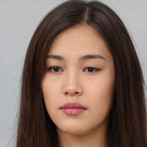 Neutral asian young-adult female with long  brown hair and brown eyes