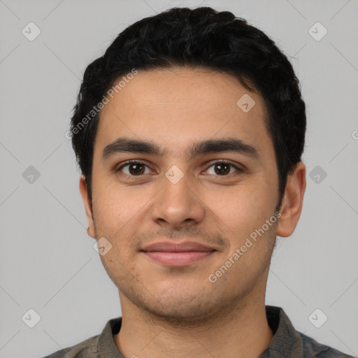 Joyful latino young-adult male with short  black hair and brown eyes