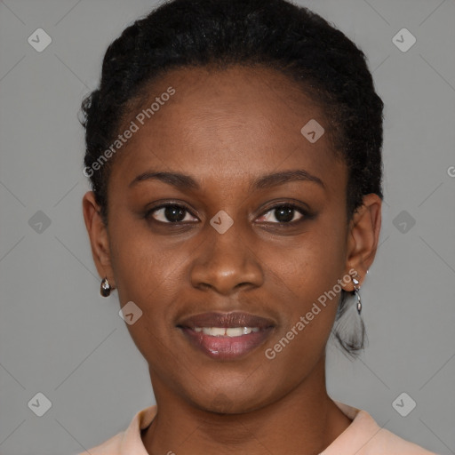 Joyful black young-adult female with short  black hair and brown eyes