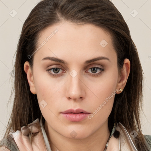 Neutral white young-adult female with long  brown hair and brown eyes