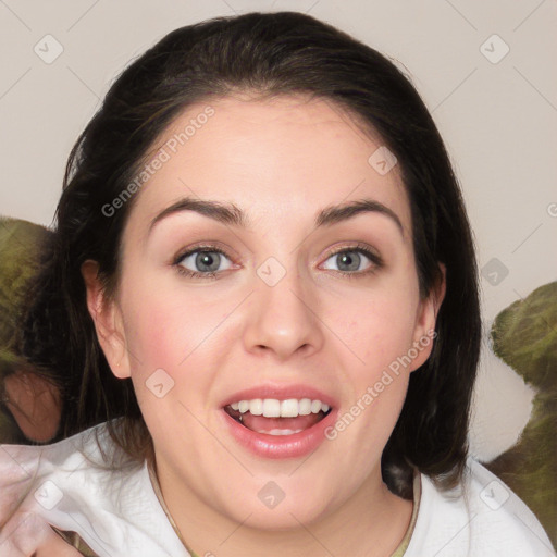 Joyful white young-adult female with medium  brown hair and green eyes